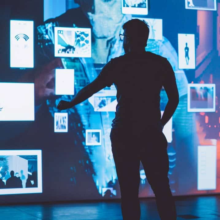 Person interacting with digital art display